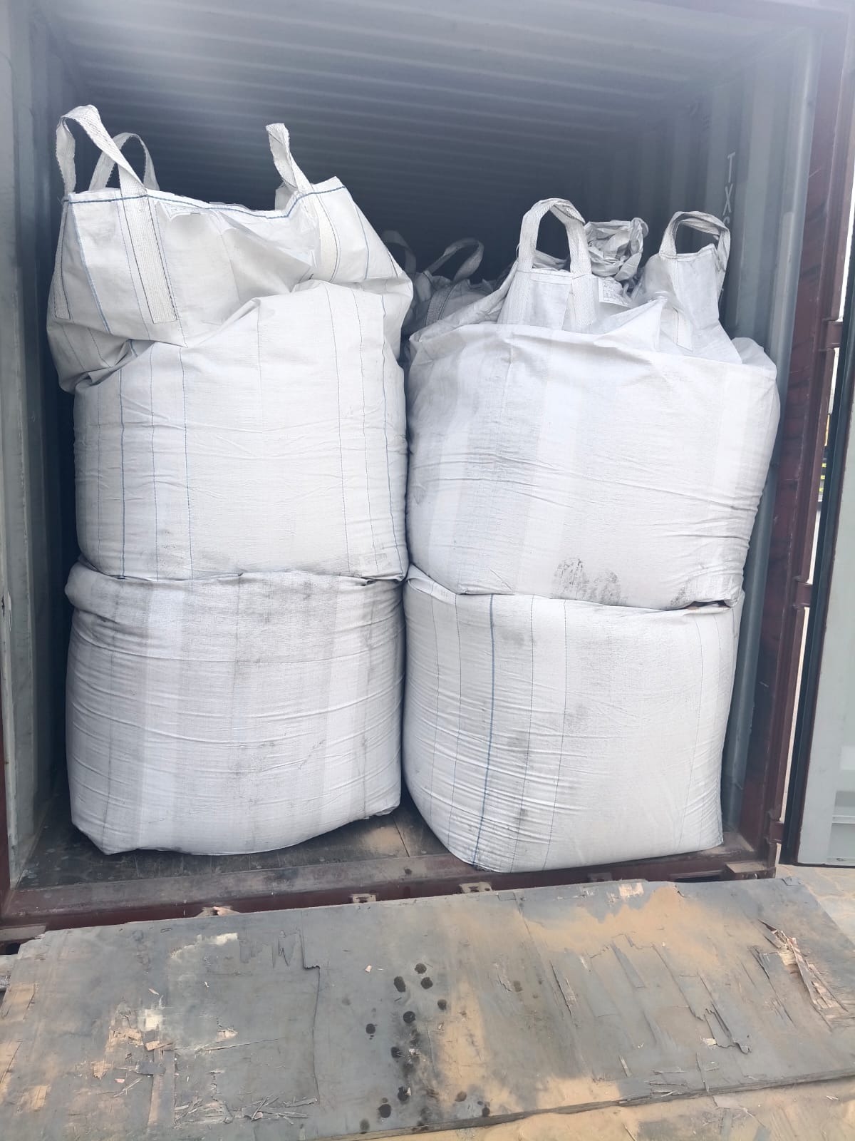 Furnace dust packed in bulk bags inside a shipping container
